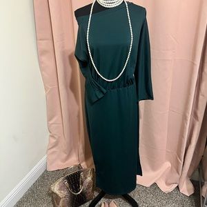 Deep green long-sleeve off-the-shoulder midi dress.